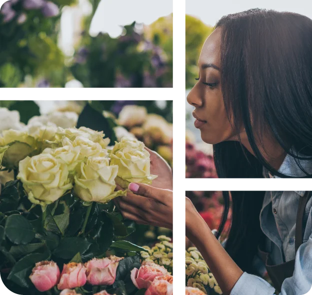 A florist bends down to smell cut white roses.
